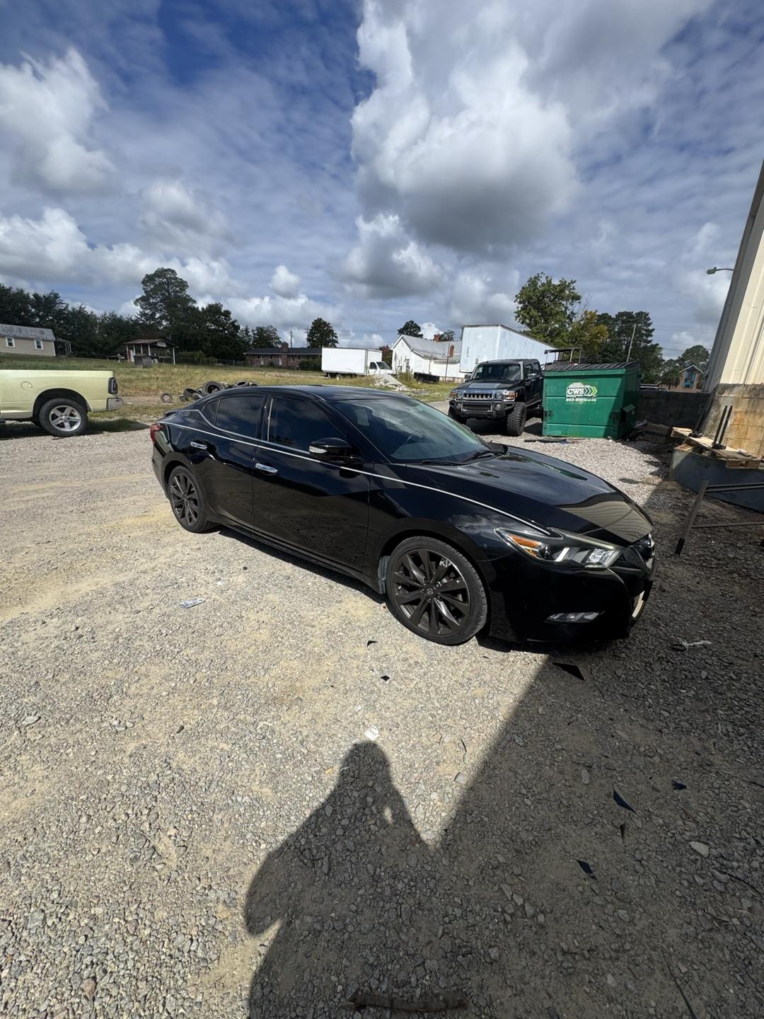 Black Nissan Maxima with tinted windows